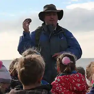 Students examining fossils during a Hampshire educational visit